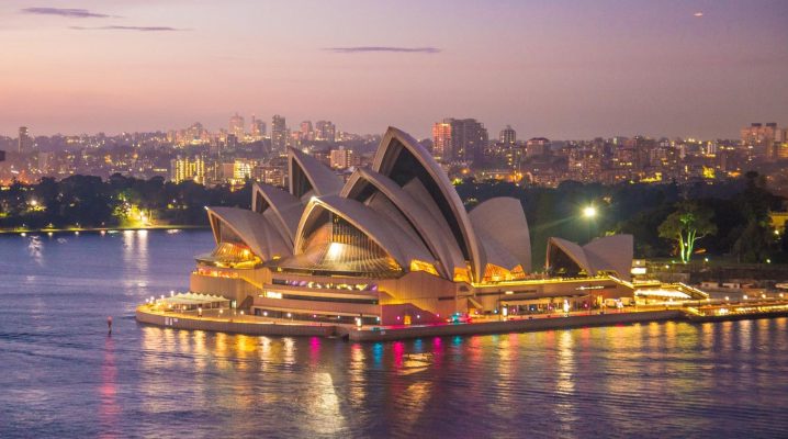 Sydney opera house at night illuminated by lights
