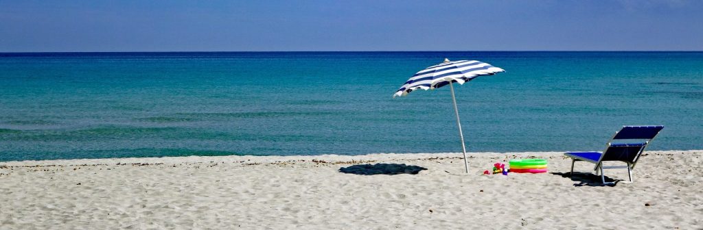 Image of a sun lounger on a beach